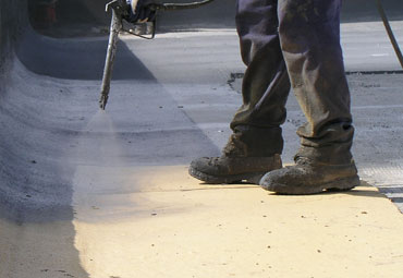 Coating systems over Killeen spray foam roof systems